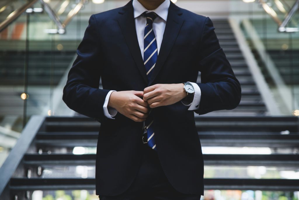 business owner standing on office steps