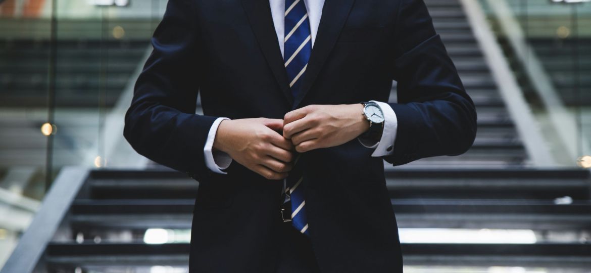 business owner standing on office steps